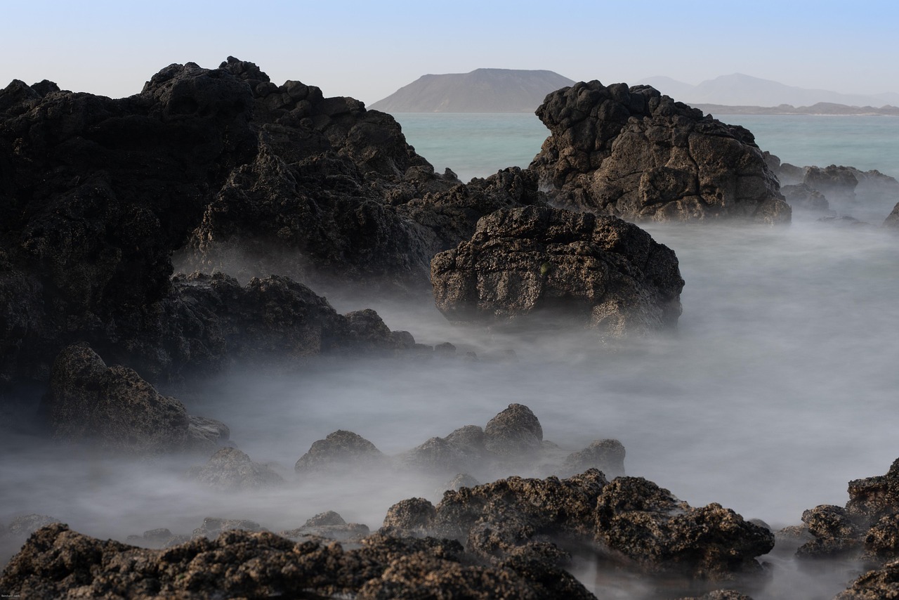 Rocky coastline shrouded in fog, Alexander Archipelago